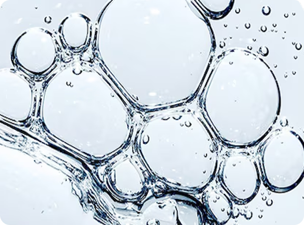Close-up of water droplets, symbolizing hydration and hyaluronic acid properties